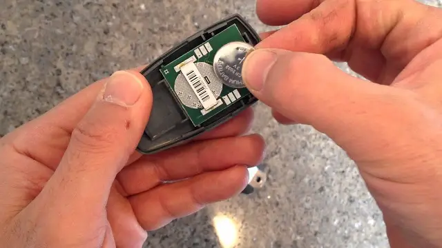 how to change battery in garage door opener remote